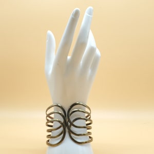 vintage metallic tone triple loop hinged bracelet