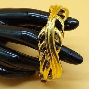 Vintage Monet gold tone hinged openwork bracelet