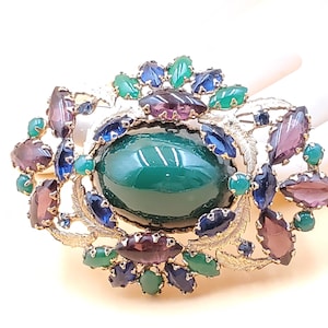 vintage high end, Schreiner style large green domed center brooch with green, purple, and blue stones