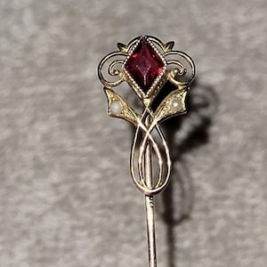 Vintage Art Nouveau 10k yellow gold stick pin with garnet and seed pearl.