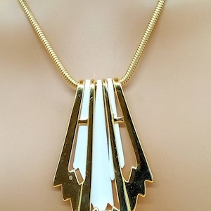 Vintage gold tone snake chain necklace with gold and white enamel panel pendant
