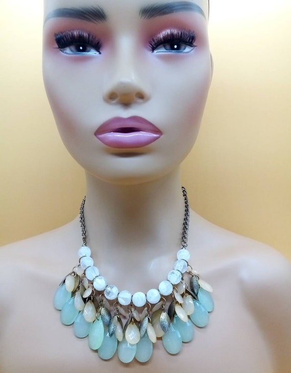 Bronze tone bib front necklace with dangling clear, green, and peach tone jeweled beads