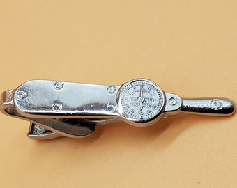 Vintage silver tone Leavens Co Torq meter tie clip
