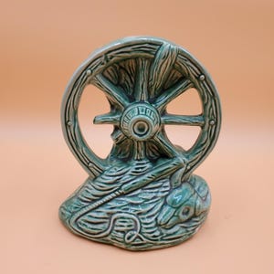 vintage unmarked McCoy green southwestern wagon wheel skull planter