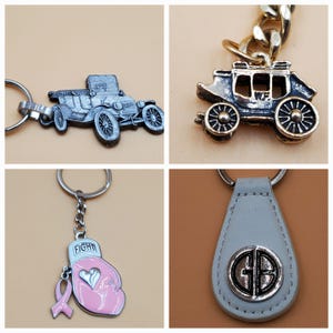 May include: A collection of keychains featuring various designs. Includes a silver car, a gold carriage, a pink boxing glove with a ribbon, and a gray leather keychain with a silver emblem. Each keychain has a metal ring for attaching keys.