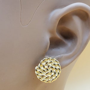 Vintage Monet gold tone textured swirl clip on earrings