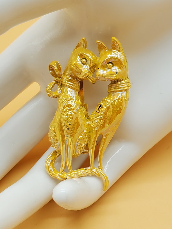 Vintage yellow iridescent love cats brooch