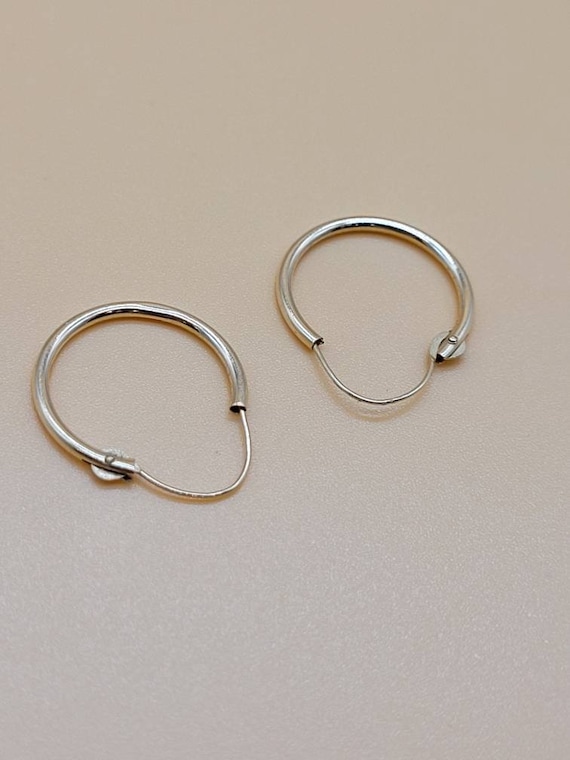 Small 14k hollow hoop earrings - image 1