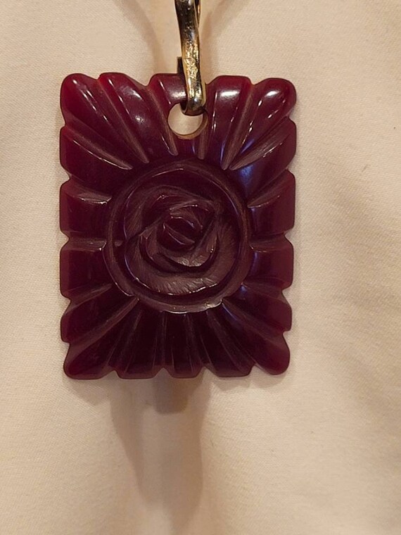 Vintage red carved Bakelite flower pendant - image 2