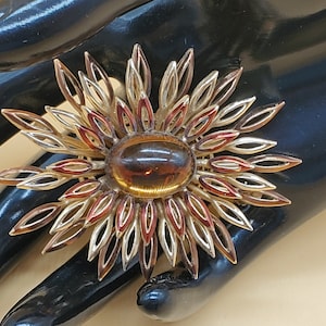 Vintage Crown Trifari gold tone enamel sunburst flower with large domed center stone
