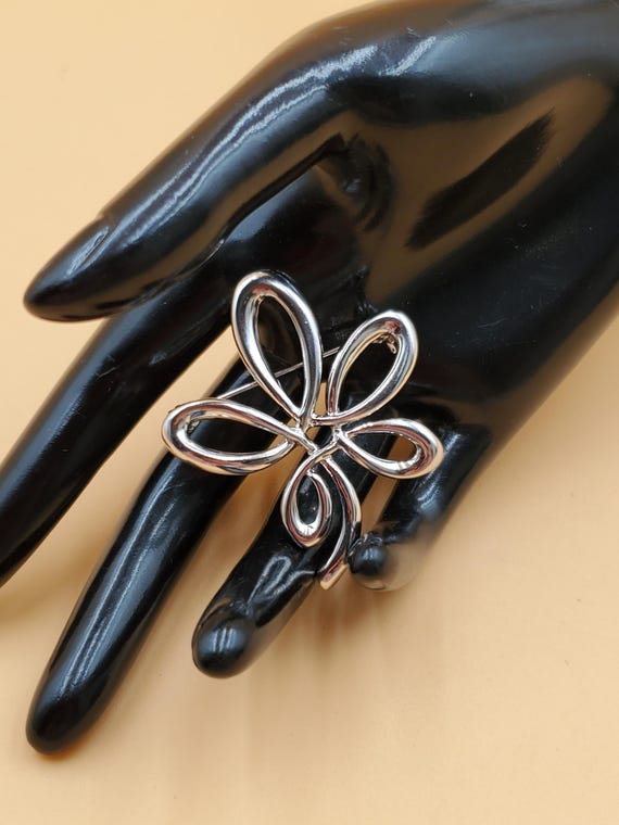 vintage silver tone open loop flower leaf brooch - image 1