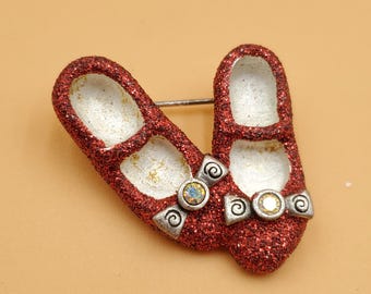 Broche vintage de 1997 de las zapatillas de rubí rojas con purpurina de El Mago de Ozz