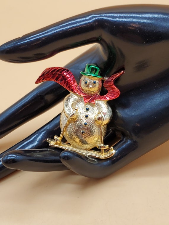 Vintage Gerrys gold tone skiing snowman brooch