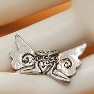 vintage small silver tone ornery fairy lapel pin