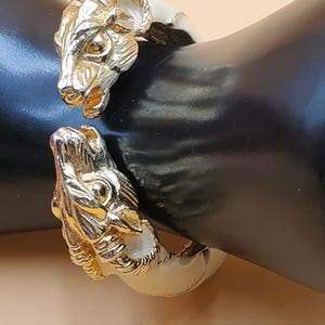 vintage Donald Stannard gold tone cream enamel double ram head spring clamp bracelet