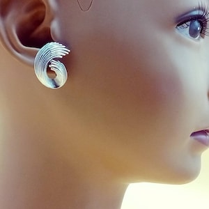 Vintage silver tone Crown Trifari texture wave clip on earrings