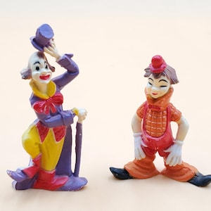 vintage hard plastic colorful clowns figurine set of 2