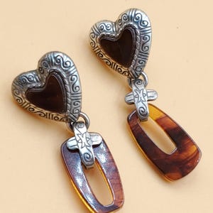 May include: A handmade wooden sign, painted white with a distressed finish, bearing the text "Welcome to our home" in a handwritten style. It features a floral design and is suitable for indoor or outdoor use.