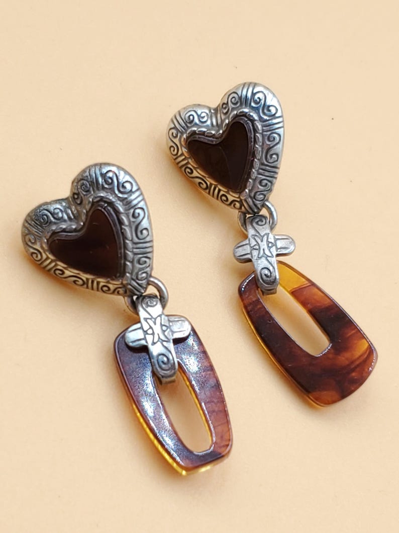 May include: A handmade wooden sign, painted white with a distressed finish, bearing the text "Welcome to our home" in a handwritten style. It features a floral design and is suitable for indoor or outdoor use.