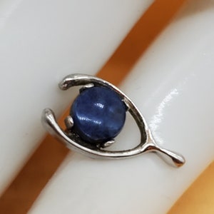 Vintage silver tone wishbone pin with faux blue sapphire