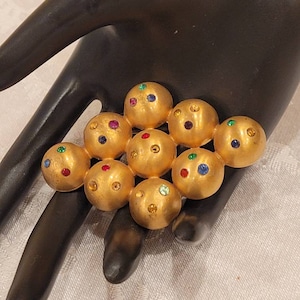 Antique Coro gold tone colored rhinestone domed ball brooch