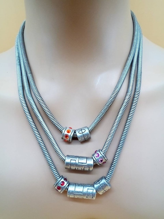 Very heavy pewter tone triple strand charm necklace Gem