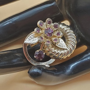 vintage Coro small gold tone loops and flower pin with purple rhinestones