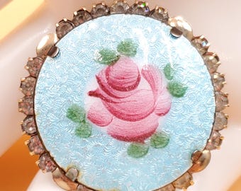Broche vintage de rosa rosa con esmalte guilloché y contorno de diamantes de imitación.