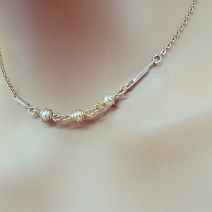 Vintage Avon gold tone chain necklace with dainty faux caged pearls