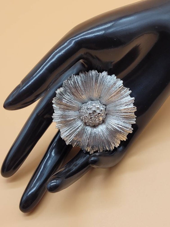 Vintage Monet silver tone flower brooch