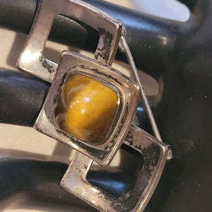 Vintage hallmarked sterling domed tigers eye brooch