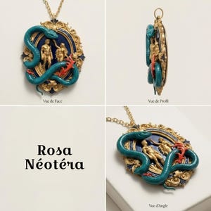 May include: A gold-toned pendant necklace with a teal snake wrapped around a blue and gold oval frame. Inside the frame are two gold figures and red accents. The text "Rosa N&eacute;oT&eacute;ra" is also visible.