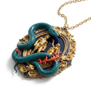 May include: Gold-toned pendant necklace featuring a teal snake wrapped around a framed scene with gold figures. The frame has a blue background and ornate gold detailing, with a coral-colored accent. The necklace chain is also gold.
