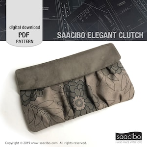 Könnte beinhalten: Eine braune und schwarze Clutch mit Blumenmuster und Klappenverschluss. Die Clutch ist aus Stoff mit Blumenmuster und hat eine Klappe aus Wildleder. Der Text "SAACIBO ELEGANT CLUTCH" ist auf dem Bild gedruckt.