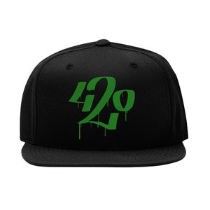 May include: Black baseball cap with a green 420 graphic. The graphic is dripping with green paint.
