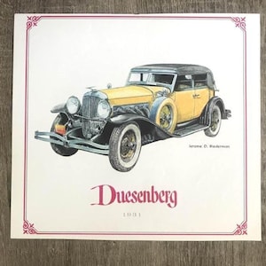 May include: Illustration of a vintage Duesenberg car from 1931. The car is yellow with a black top and fenders. The image has a decorative border and the name "Duesenberg" is written in red script below the car.