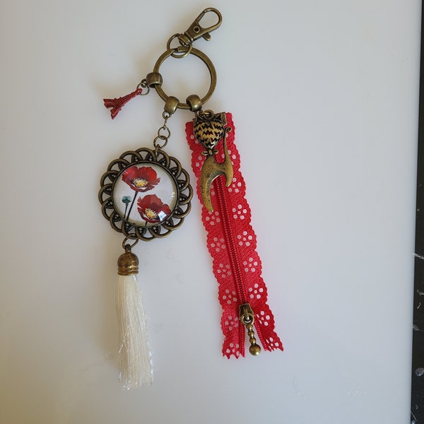 Porte clé, bijoux de sac bronze avec cabochon coquelicot