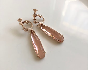 Festive ear clips in champagne gold pink