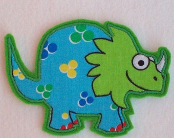 Grön/turkos dinosaurielapp