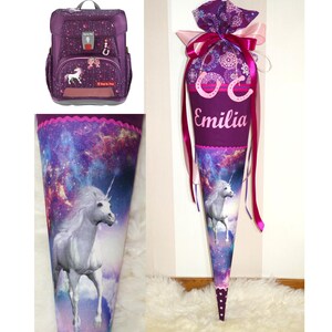 May include: Purple and pink school backpack and matching cone with a unicorn and galaxy print. The cone has the name "Emilia" embroidered on it.