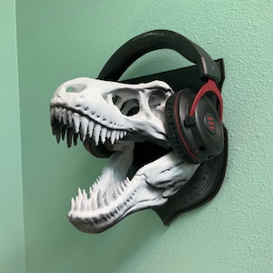¡Colgador de pared con forma de cráneo de T-Rex! Soporte para dinosaurio tiranosaurio, como estegosaurio, apatosaurio o raptor. Ideal para llaves, sombreros, abrigos y bolsos. Decoración de pared con forma de cráneo de animal.