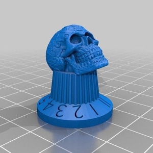 Puede incluir: Pomo de calavera azul impreso en 3D con un diseño detallado y los números 1, 2, 3 y 4 alrededor de la base.