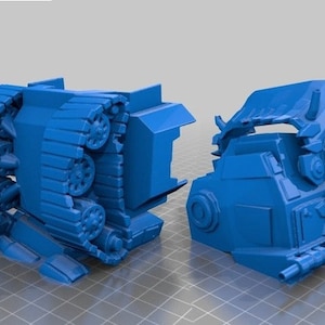 Puede incluir: Un modelo de tanque futurista de plástico azul, dividido en dos piezas. El tanque tiene un sistema de orugas grande y detallado y una torreta elevada con un cañón.