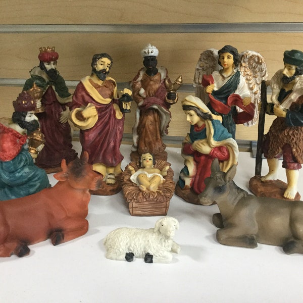 Eleven piece, 5.5” resin Christmas Nativity characters in styrofoam container.  195-6101