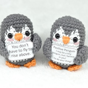 May include: A set of three ceramic mugs with a speckled, matte finish. The mugs are in shades of cream, light gray, and dark gray. Each mug has a simple, minimalist design and a rounded handle. Perfect for coffee or tea.