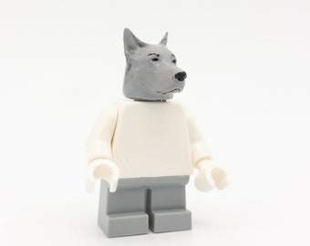 grey dog with figure from LEGO