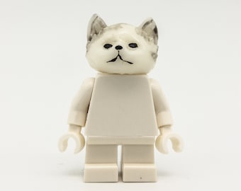 white cat with figure from LEGO