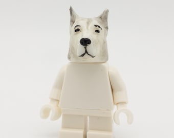 white dog with figure from LEGO