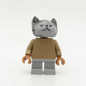 gray cat with figure from LEGO
