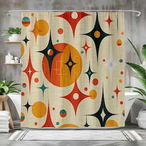 May include: A shower curtain with a cream-coloured background, patterned with orange, red, teal, and black starburst shapes and circles. The design has a mid-century modern aesthetic.